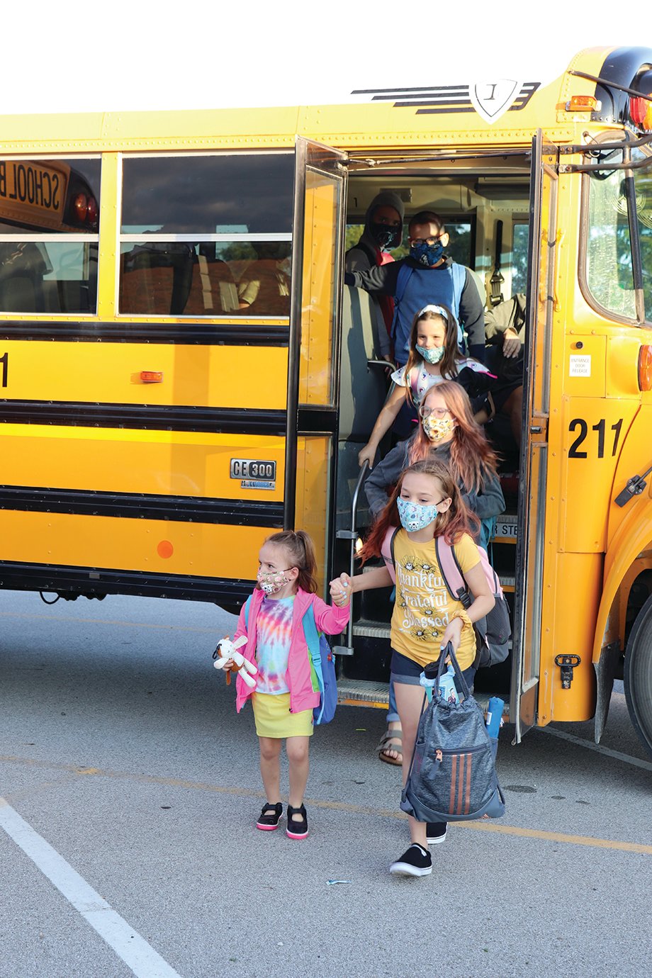 Students pour off the bus Thursday for their first official day of school at New Market Elementary.